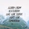 Inspirational motivational quote `Learn from yesterday. Live for today. Hope for Tomorrow.` with mountain view background.