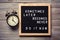 Inspirational motivational quote Sometimes later becomes never. Do it now words on a letter board on wooden background near