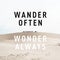 Inspirational motivational quote `wander often, wonder always` on desert background.