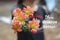 Inspirational motivational quote - You deserve better. With young girl holding and showing beautiful bouquet of peach dahlia.