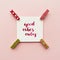 Inspirational quote good vibes only handwritten with watercolor in calligraphy style, miniature clothespins on a pale pink pastel