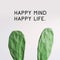 Inspirational quote `Happy Mind Happy Life`. Cactus plant on white background.