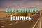 Inspirational quote - Letâ€™s start the journey. Blurred view of empty asphalt roaf