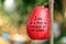 Inspirational text message on fresh red water apple fruit on tree. Love is a fruit in season at all times. The concept of love.