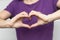 Inspire inclusion. Zoomers symbolize love. Woman finger heart dressed purple t-shirt. Hand showing heart