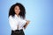 Inspired African American businesswoman in formal wear standing