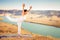 Inspired asian woman doing exercise of yoga at mountain range