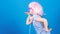 Inspired by music. Little kid listening music. Cute kid with headphones blue background. Small girl headphones pink wig