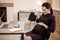 Inspired pregnant businesswoman experiencing baby movement