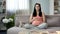 Inspired pregnant lady stroking tummy, dreaming of soonest appearance of newborn