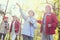 Inspired senior woman hiking with her friends