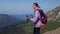 inspired young woman at top of mount, travelling and backpacking in mountains