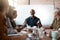 Inspiring his team with his expertise. a businessman leading a meeting in the boardroom.