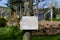 Inspiring sign `Gardening feeds the Soul` with a German kitchen garden in the background