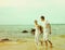 Instagram colorized vintage couple on beach portrait