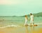 Instagram colorized vintage couple on beach portrait