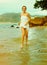 Instagram colorized vintage girl on beach portrait