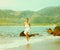 Instagram colorized vintage girl on beach portrait