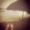Instagram image of womans feet relaxing on tropical beach