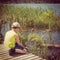 Instagram of young boy feeding ducks from his hand