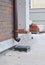 Install roof gutter drain downspout pipe on brick house wall