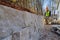 An installation of concrete block wall was observed as the contractor worked on a project to build retaining walls on a