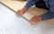 installation of flooring, a worker mounts a laminated board