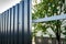 Installation of gray fence from metal profile