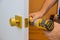 Installation with a lock in the door leaf using an drill screwdriver,for holding screws