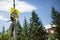 Installation road sign on pole. Road worker sets sign.