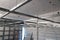 The installation of suspended ceiling at the construction site