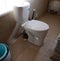 installation of a toilet bowl in the bathroom of a private house. construction and renovation concept.