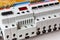Installed automatic circuit breakers with voltage limiter in the white plastic mounting box closeup