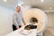 installer engineer of mri apparatus with tools near scanner