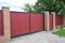 Installing Brick and Metal Fence Gate with Door. Red Metal Fencing Panels.