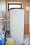 Installing solar water tank in boiler room. Solar water heating system.