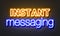 Instant messaging neon sign on brick wall background.