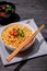 Instant noodle in bowl cooked spicy taste topping