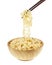 Instant noodle in a bowl wooden with chopstick on white background