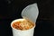 Instant noodles in white cups, unbranded. on Dark background