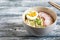 Instant noodles on wooden background. Cooked chinese instant noodles. Soup Ramen with egg and radish