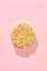 Instant pasta in the form of a circle on a pink background