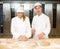 Instructor and baker apprentice kneading bread dough