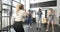 Instructor giving a boxing class to people in a gym