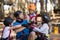 Instructor and kids forming hand stack in park