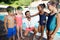 Instructor with little swimmers standing at poolside