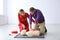 Instructor and man practicing first aid