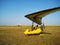 The instructor pilot and passenger sit in a hang glider