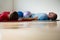 Instructor and student exercising while lying on mat in studio