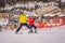 Instructor teaches boy skier to use on ski lift